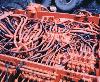 A jumble of hydraulic cables on a piece of mining equipment